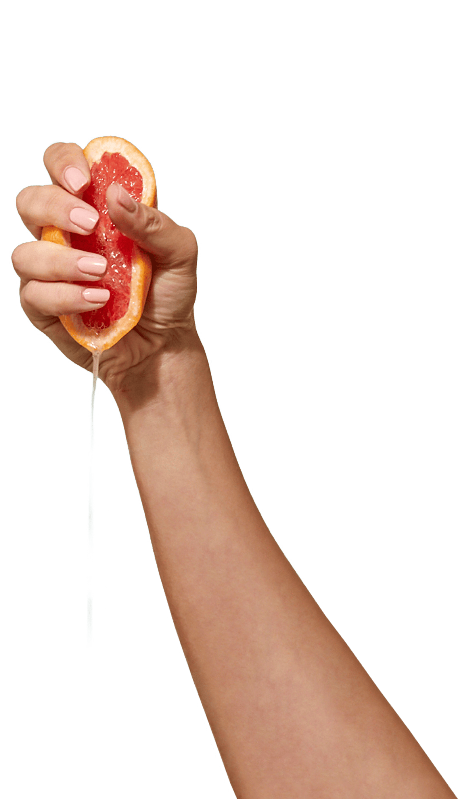 CARE halbe Grapefruit wird in einer Hand ausgedrückt