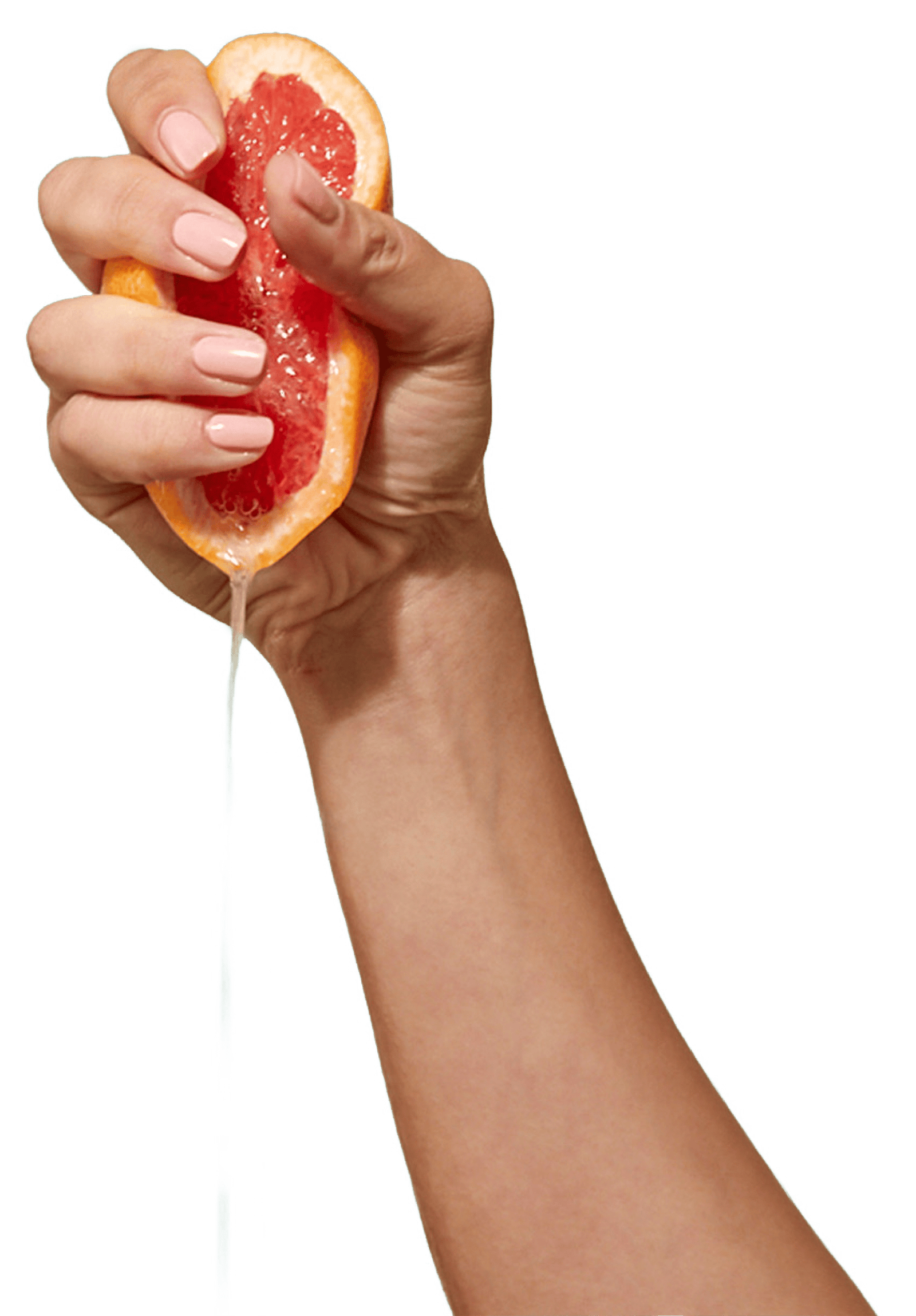CARE halbe Grapefruit wird in einer Hand ausgepresst